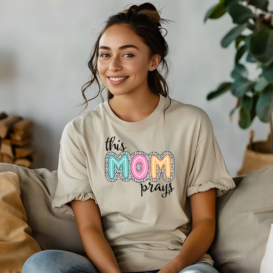 This Mom Prays T-Shirt: A heartfelt design celebrating faith and motherhood. Stylish, meaningful, and perfect for moms who find strength in prayer.