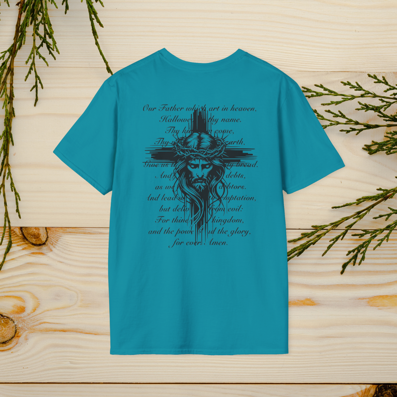 The Lord's Prayer T-Shirt features a striking Jesus design with the full text of the prayer, combining faith and style. A wearable reminder of devotion and spirituality, perfect for any occasion.