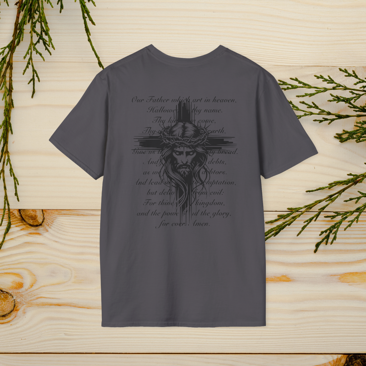 The Lord's Prayer T-Shirt features a striking Jesus design with the full text of the prayer, combining faith and style. A wearable reminder of devotion and spirituality, perfect for any occasion.