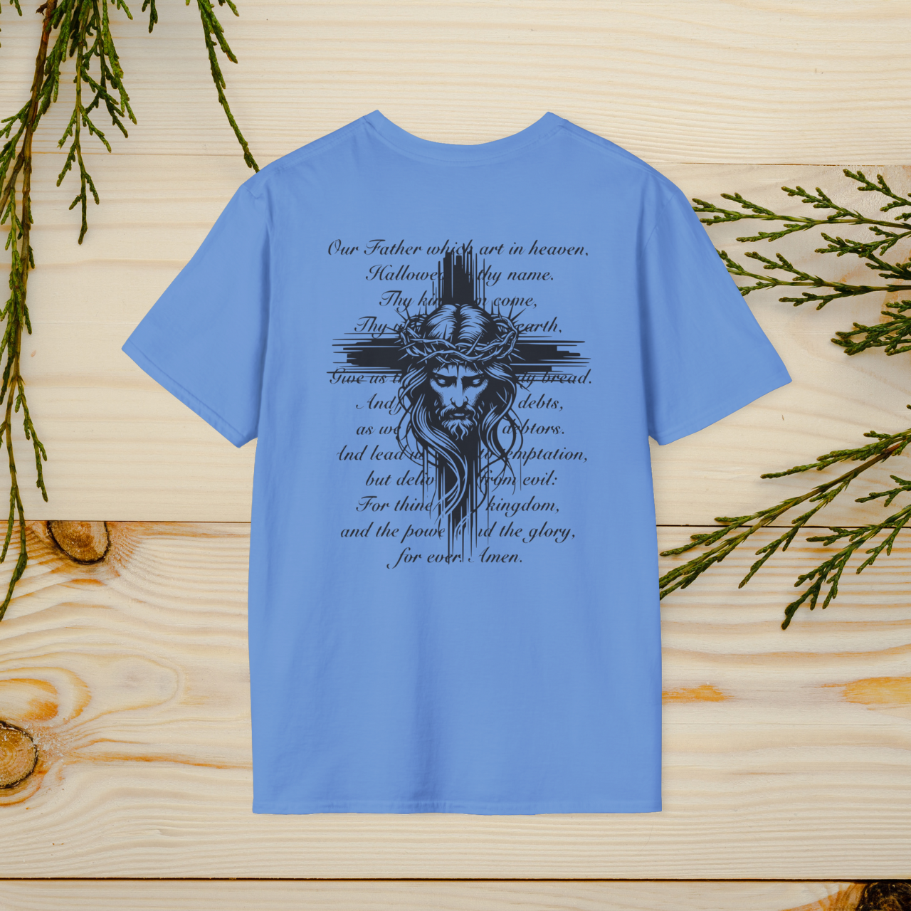 The Lord's Prayer T-Shirt features a striking Jesus design with the full text of the prayer, combining faith and style. A wearable reminder of devotion and spirituality, perfect for any occasion.